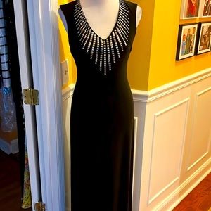 Long black dress with embellished front and back zip